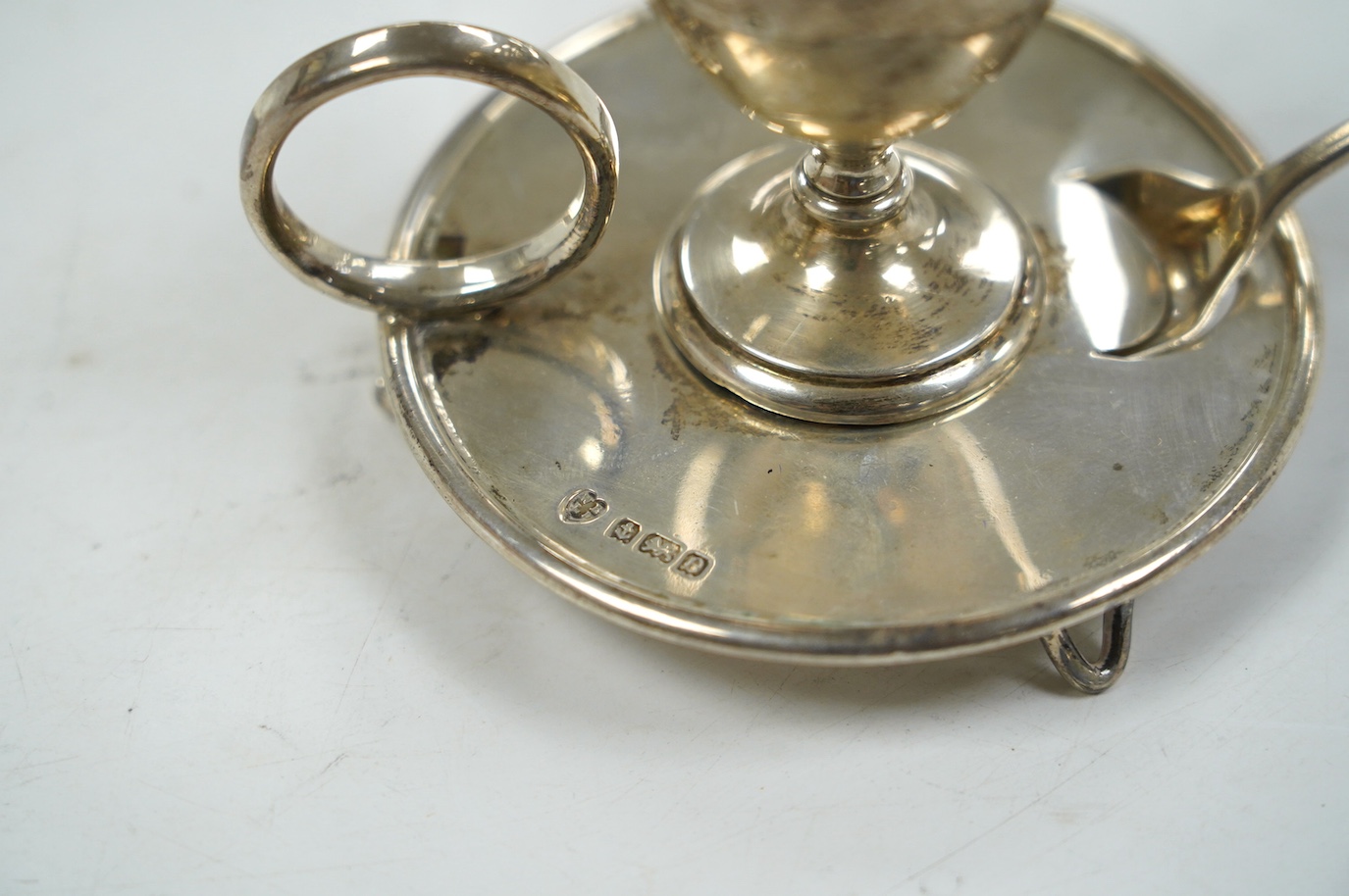 An Edwardian silver egg cup on stand, Birmingham, 1904, 67mm, together with a George III associated spoon. Condition - fair